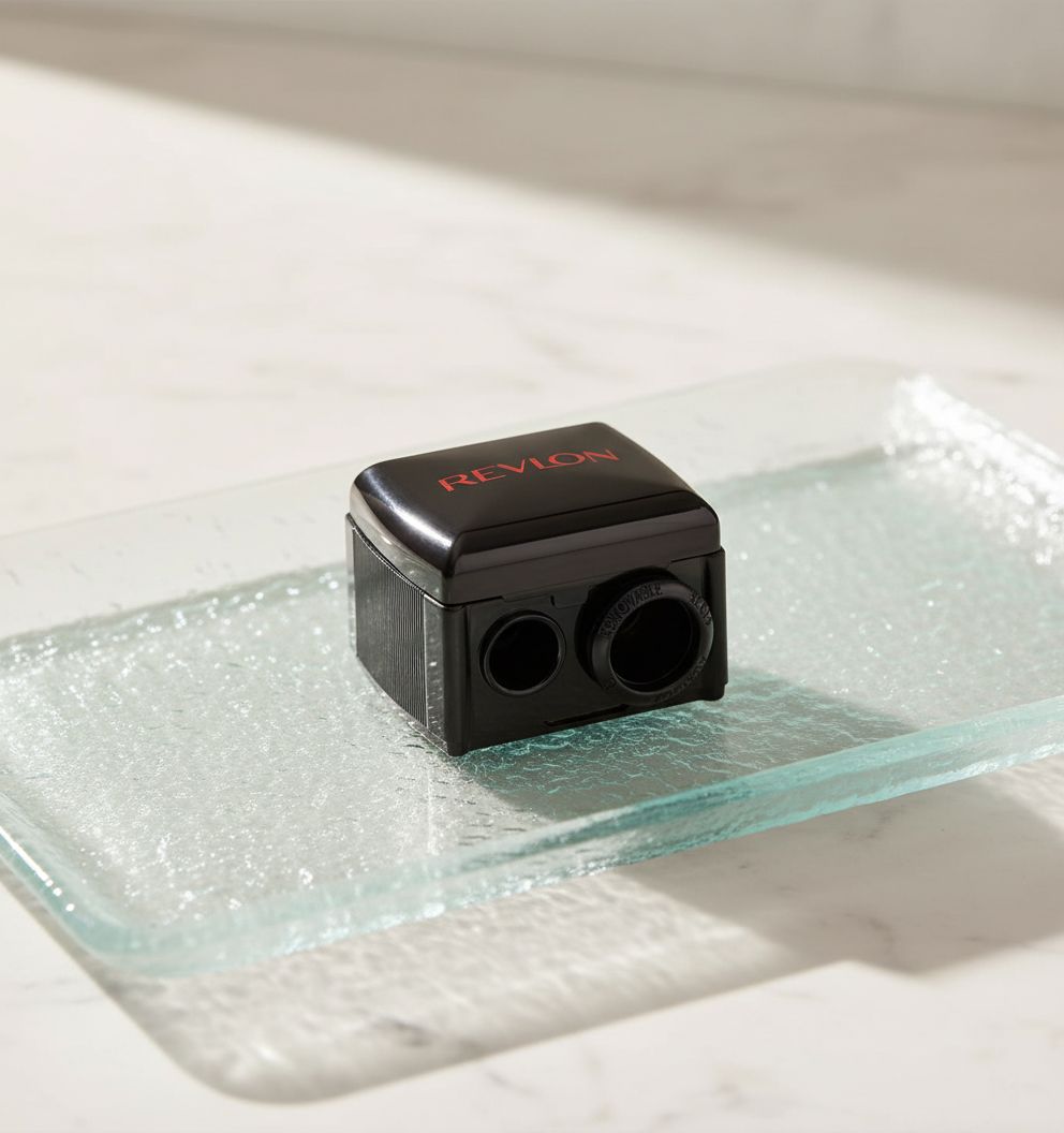 Revlon universal pencil sharpener in neutral tone, designed for wooden and plastic makeup pencils — view 1