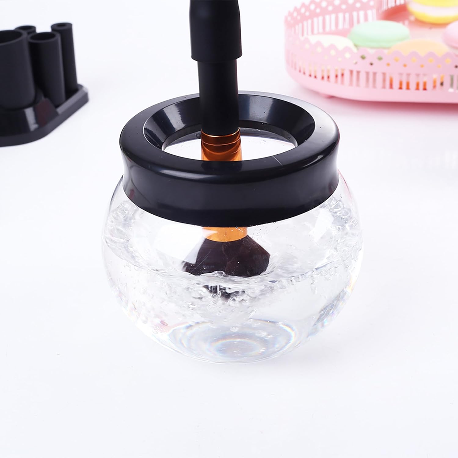 Electric makeup brush cleaner dryer machine in neutral finish, shown cleaning and drying brushes automatically — view 2