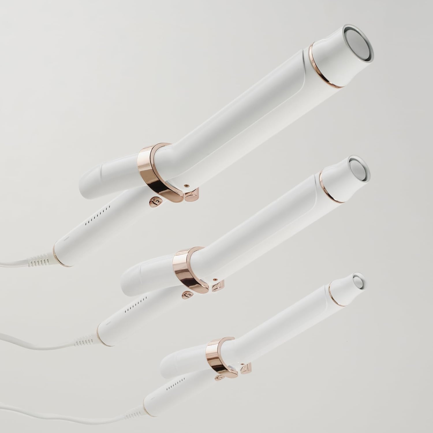 T3 SinglePass Curl X curling iron with ceramic barrel in neutral finish, showing interchangeable barrel sizes — view 2