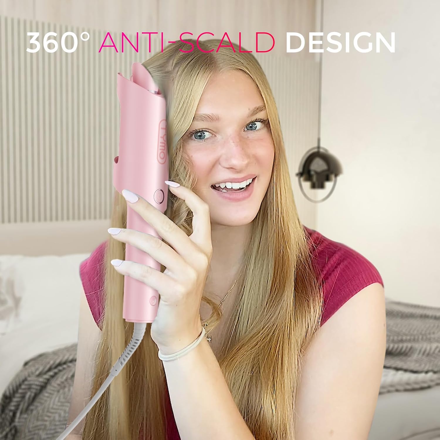 Automatic rotating curling wand in pink with ceramic coating, shown creating beach waves hairstyle — view 4